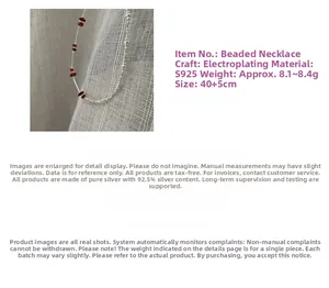 Detailed view of S925 sterling silver beaded necklace with red stones and 40+5cm scale