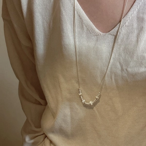 S925 sterling silver star snake chain necklace with beads on beige knit sweater