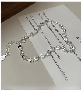 Detailed macro shot of S925 sterling silver heart chain links and S925 hallmark tag
