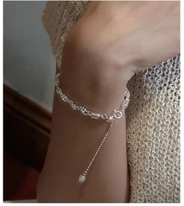 Detailed view of S925 sterling silver twisted beaded bracelet with adjustable chain