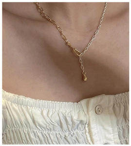 Detail of S925 sterling silver Y-shaped necklace featuring two-tone gold and silver chains