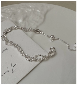 Detailed macro view of S925 sterling silver beaded twisted chain with adjustable slider