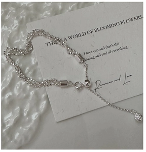 Close-up of triple-strand S925 sterling silver beaded bracelet with adjustable slide clasp