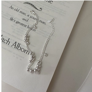 Detailed close-up of S925 sterling silver chain with sliding rings and lobster clasp