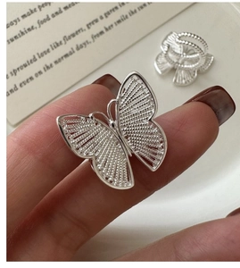Detailed macro shot of a S925 sterling silver butterfly ring with layered filigree wings