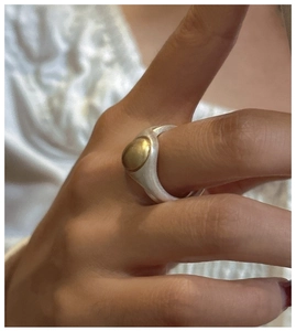 Detailed close-up of S925 sterling silver ring featuring a matte finish and golden bean