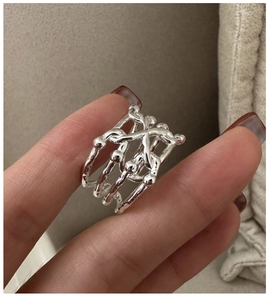 Detail of S925 sterling silver multi-layer crisscross ring with liquid metal texture