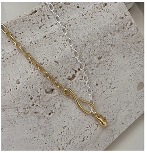Detail of S925 silver matte chain with artistic S-hook clasp and metal waterdrop pendant