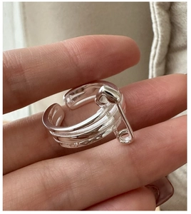 Detail of S925 sterling silver safety pin ring with a triple-layered wrap design