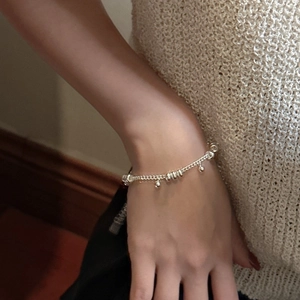 Elegant S925 sterling silver beaded bracelet for women featuring minimalist round silver charms