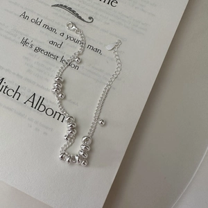 Minimalist S925 sterling silver beaded bracelet with lobster clasp on vintage book
