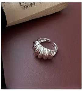 Macro view of S925 sterling silver croissant ring with textured ribbed finish and S925 stamp