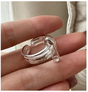 Macro shot of S925 sterling silver multilayer open ring with safety pin design