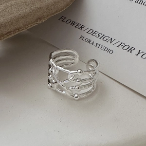 Minimalist S925 sterling silver multi-layer crisscross open ring on aesthetic background