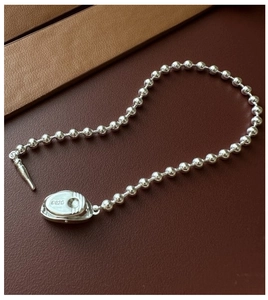 Detailed macro view of S925 sterling silver beaded bracelet with secure clasp closure