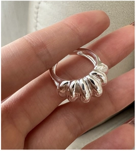 Detailed macro view of S925 sterling silver croissant ring with polished spiral texture