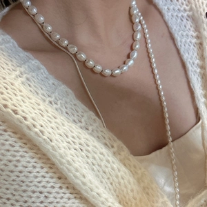 Layered S925 silver pearl necklace set with baroque pearls on knit sweater model