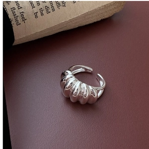 Close-up of S925 sterling silver croissant ring showing detailed texture and hallmark