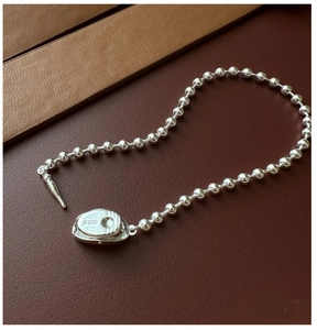 Close-up of S925 sterling silver bead bracelet with engraved hallmark on clasp