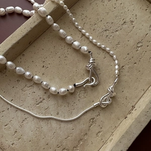 Elegant S925 silver long pearl sweater necklace with vintage knot design and baroque pearls