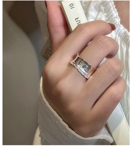 Detail shot of wide S925 sterling silver lace ring with sparkling cubic zirconia accents