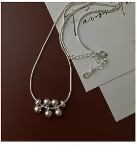 Detail shot of S925 sterling silver beads necklace with matte finish on snake chain