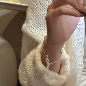 S925 sterling silver minimalist bracelet featuring a sleek curved design and lobster clasp