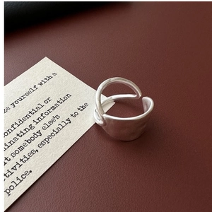 Macro shot of minimalist S925 sterling silver ring with double-layered matte texture