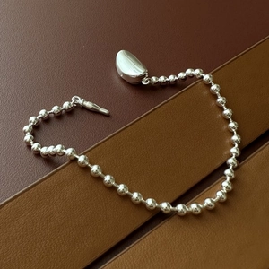Polished S925 sterling silver beaded bracelet with pebble charm and T-bar toggle clasp