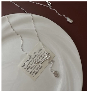 Detail of S925 sterling silver matte necklace with irregular pendant and toggle clasp