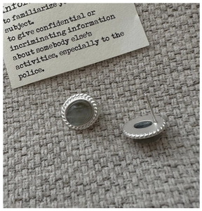 Close-up of S925 silver labradorite stud earrings with vintage twisted rope texture