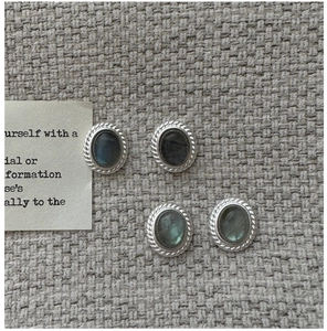 Detail of S925 silver labradorite stud earrings with vintage twisted rope edge texture