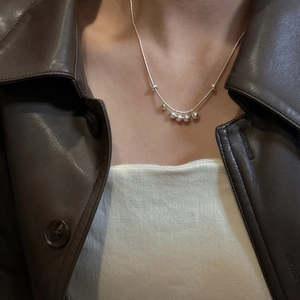 Minimalist S925 sterling silver beaded necklace with five polished metallic beads on a thin chain