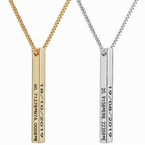 Detailed view of custom engraved gold and silver vertical bar pendants with coordinates