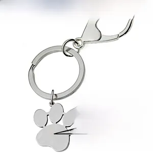 Close-up of polished silver pet paw keychain pendant for personalized laser engraving