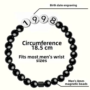 Detail of 8mm black magnetic stone bracelet with custom 1998 birth date engraving