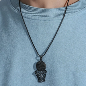 Close-up of hip-hop basketball hoop pendant and black chain on a model wearing light blue tee