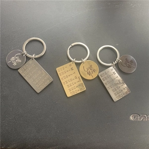 Close-up of personalized stainless steel calendar keychain with Love You engraving