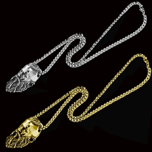 Detailed close-up of gold and silver Viking warrior head pendants on square pearl chains