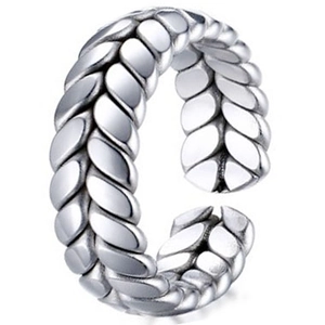Macro detail of silver braided wheat pattern ring with oxidized vintage finish
