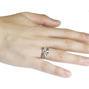 Detail of silver demon wing and arrow wrap ring with adjustable open band design