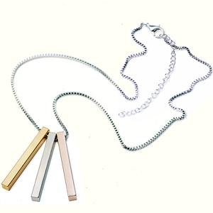 Three-tone cubic pillar pendant necklace in gold silver and rose gold finishes