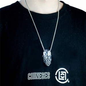Men's hip hop necklace with viking head pendant and polished box chain on black t-shirt