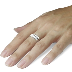 Minimalist woven wheat pattern open ring in silver finish shown worn on a finger