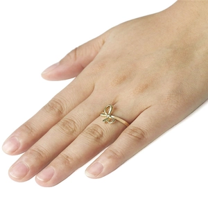 Elegant gold bow-shaped minimalist open ring for women with polished finish and slim band