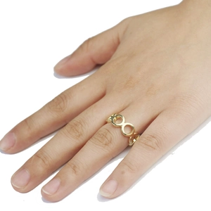 Fashionable golden XO pattern open ring for women with polished metallic finish