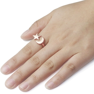 Adjustable rose gold star and moon open ring with polished metallic finish for women