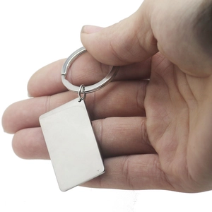 Personalized stainless steel keychain with rectangle pendant held by hand