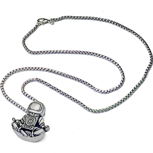 Vintage astronaut pendant necklace featuring a meditating astronaut on a box chain