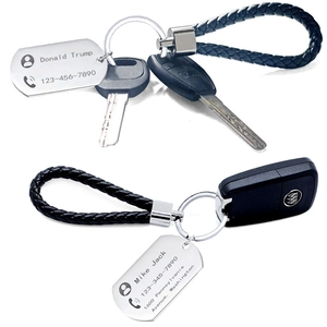 Customized stainless steel keychain with laser-engraved phone number on black woven rope